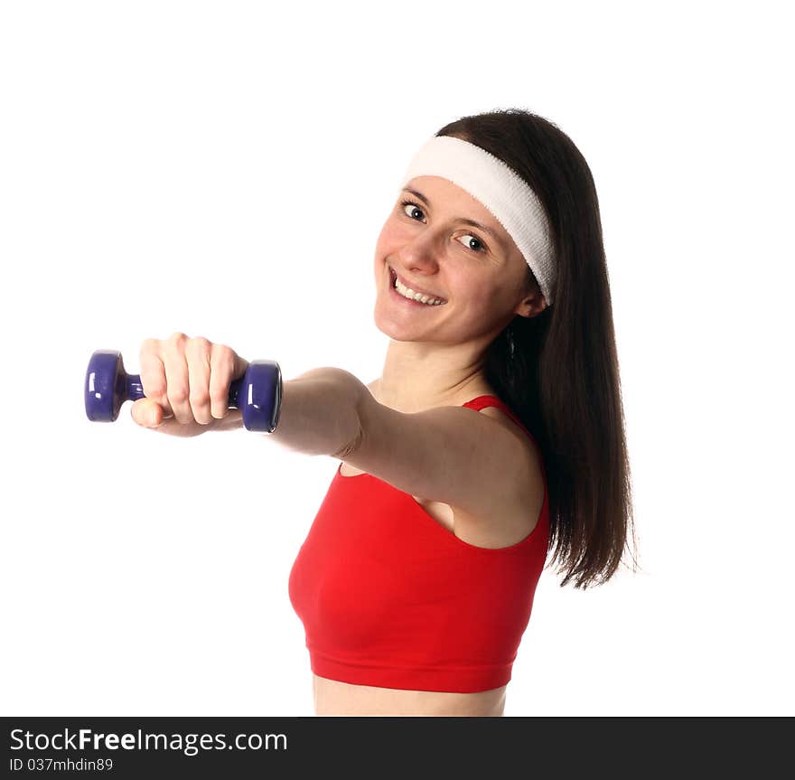 Happy young woman exercising with a dumbbell