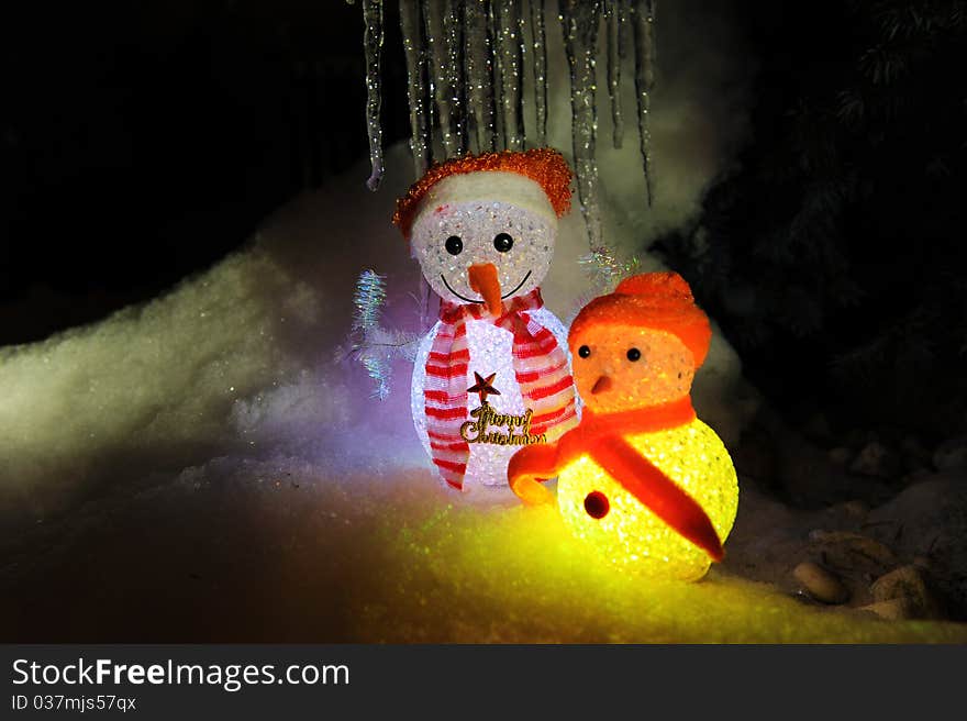 A small snow man toy doll as Christmas decoration.