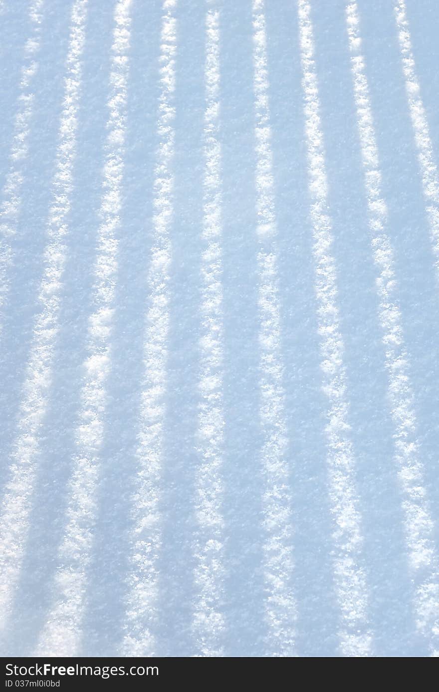 Shade from a picket  fencing on fresh snow. Shade from a picket  fencing on fresh snow