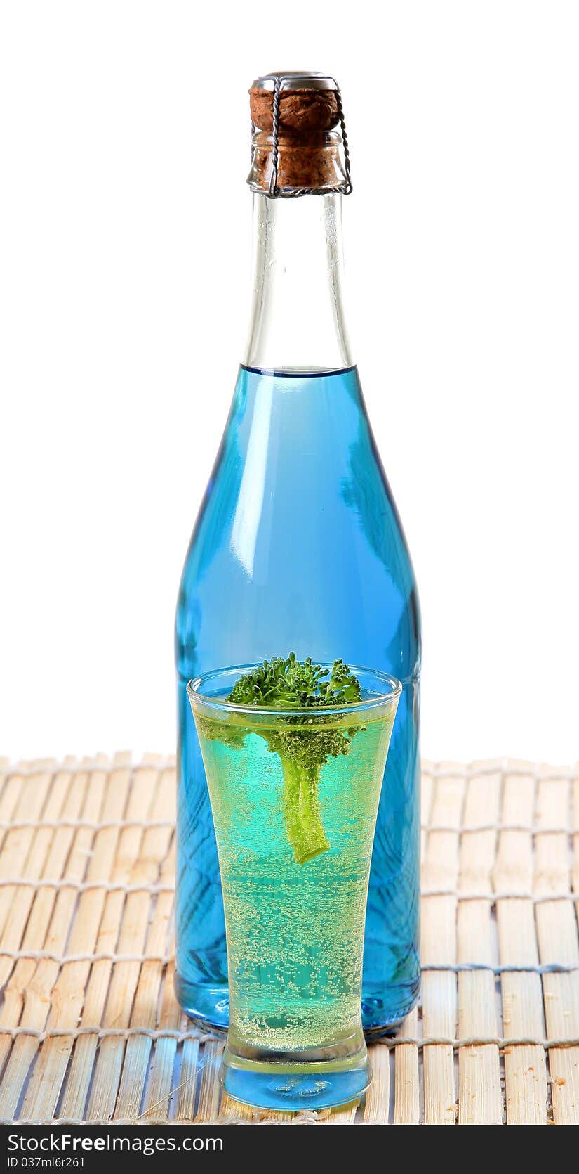 Blue colored carbonated party drink with white background.