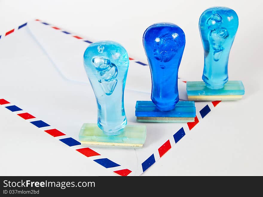 Three blue rubber stamp on air mail envelope on white background