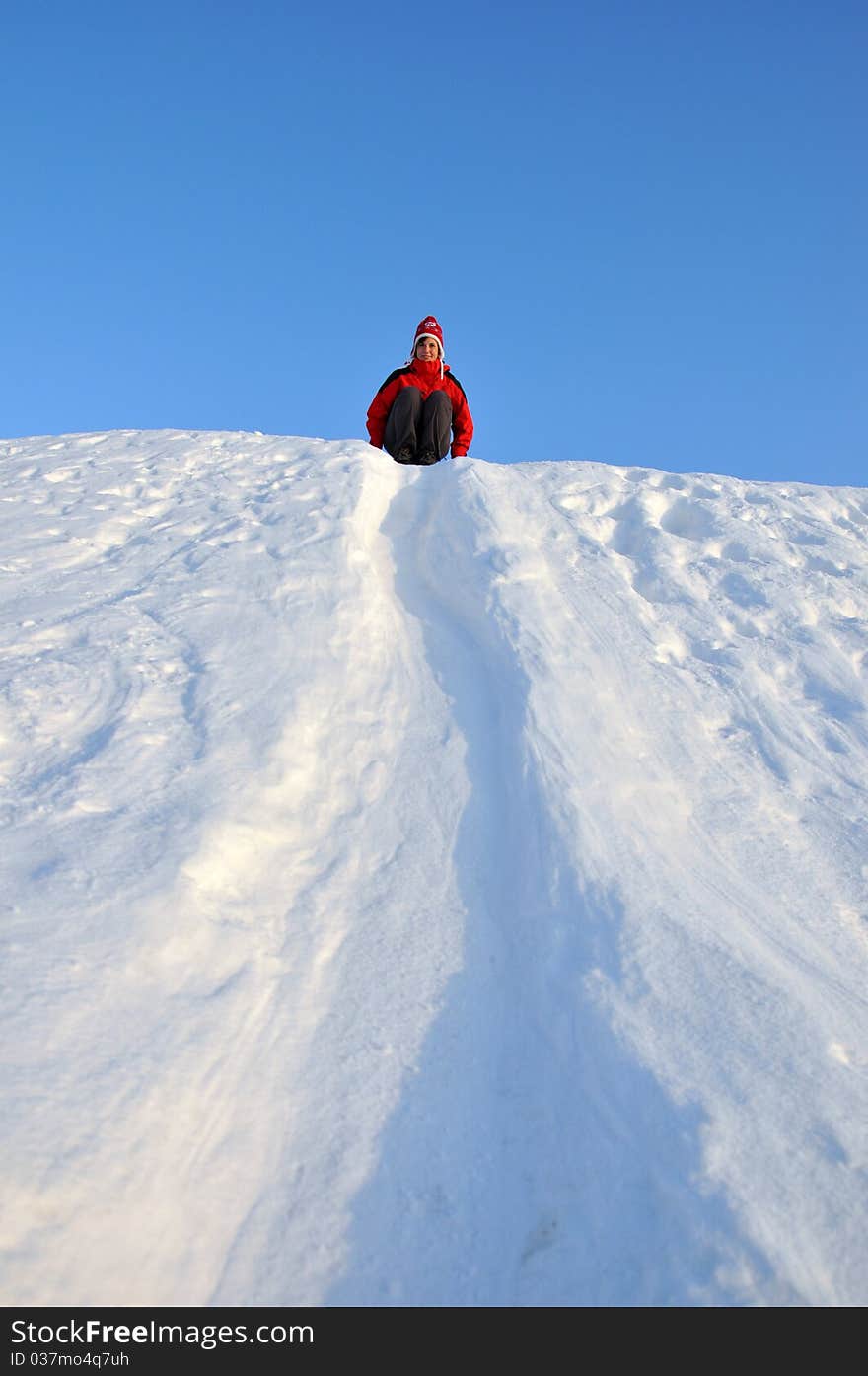 Woman sliding at snow slideway