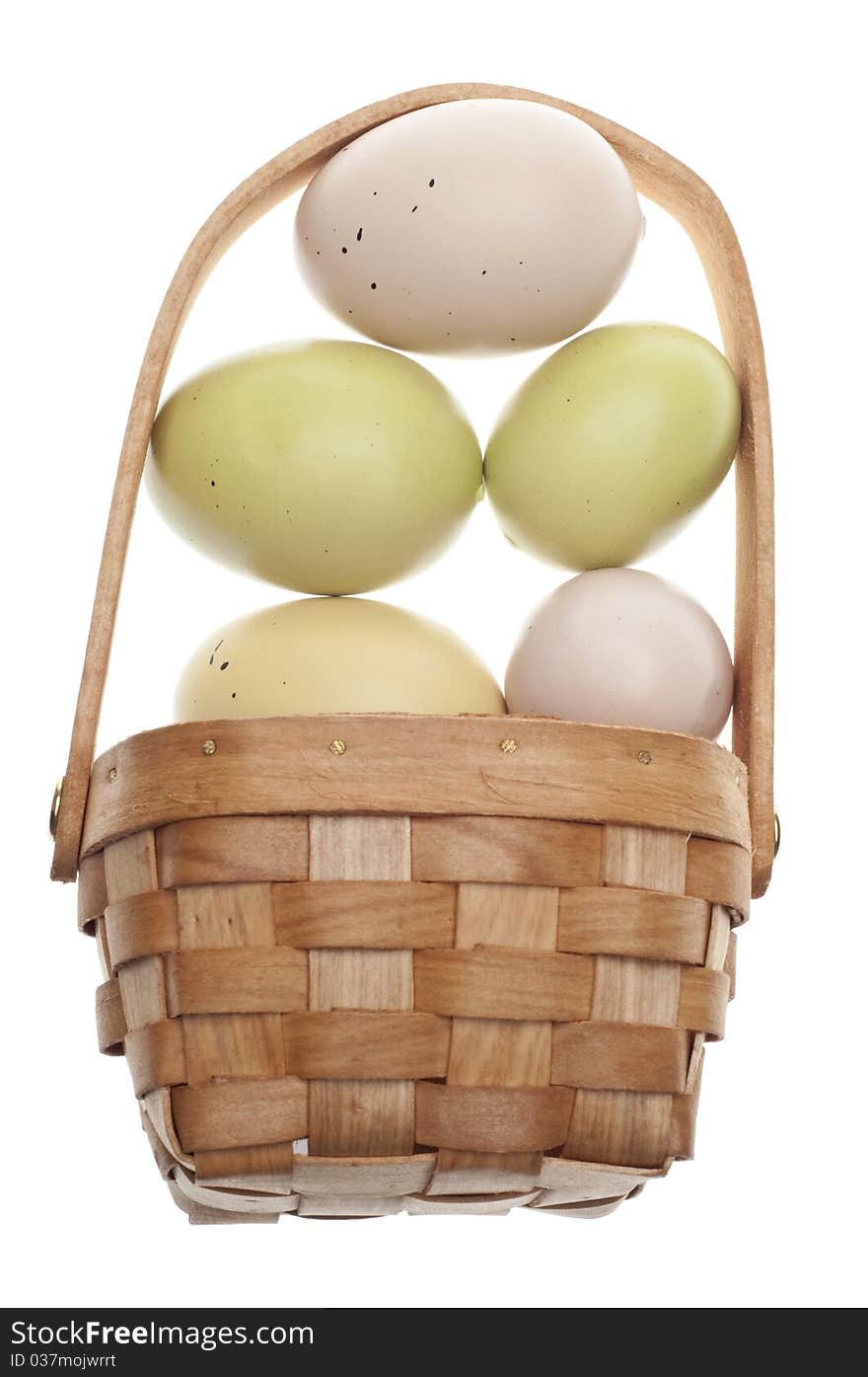 Speckled Easter Eggs in a Basket Isolated