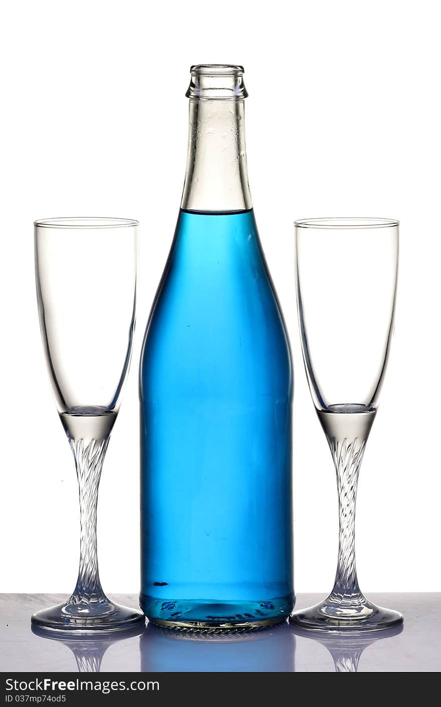 Two champagne glasses and a bottle isolated on white background. Two champagne glasses and a bottle isolated on white background