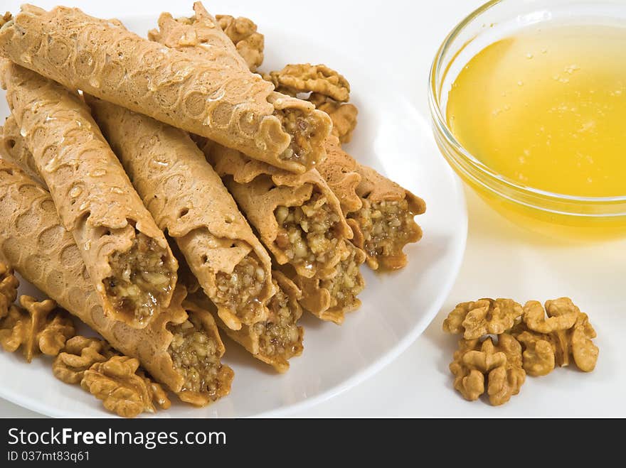 Waffles with honey-nut filling served on white plate