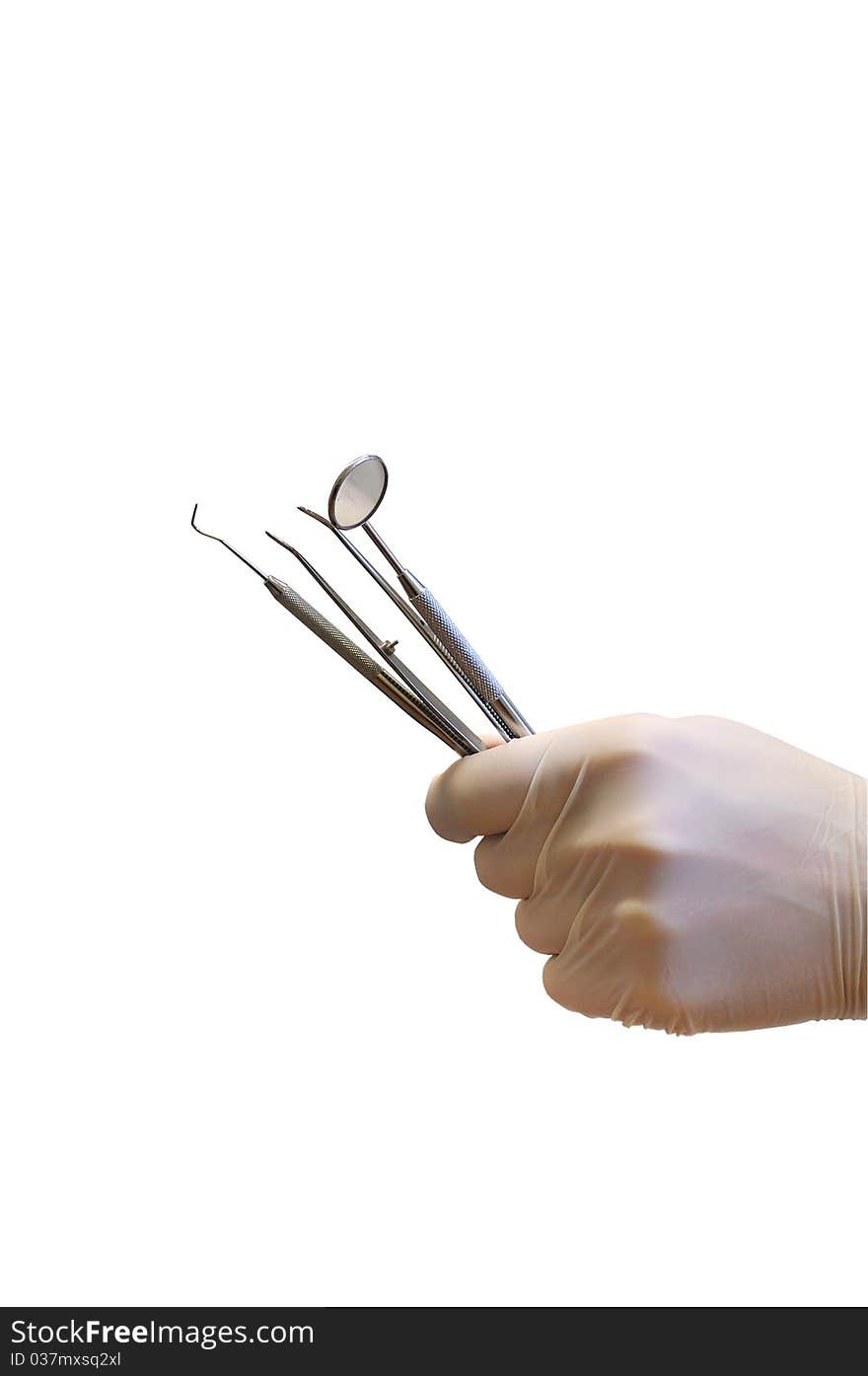 Hand in glove holding dentist instrument. Hand in glove holding dentist instrument