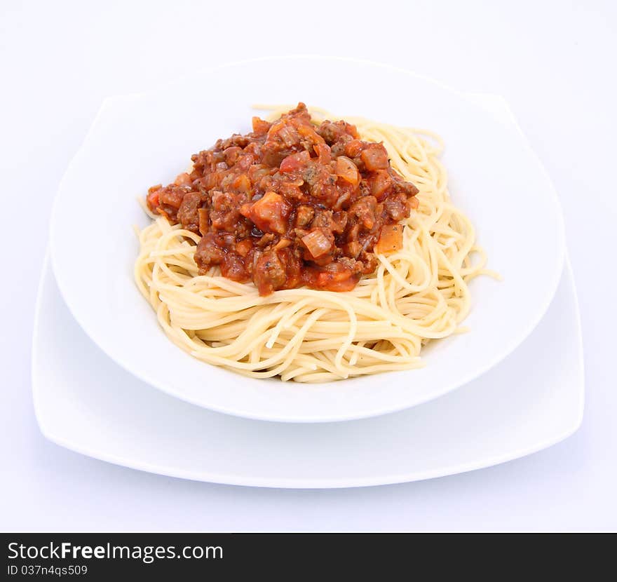 Spaghetti bolognese on a plate on a white background