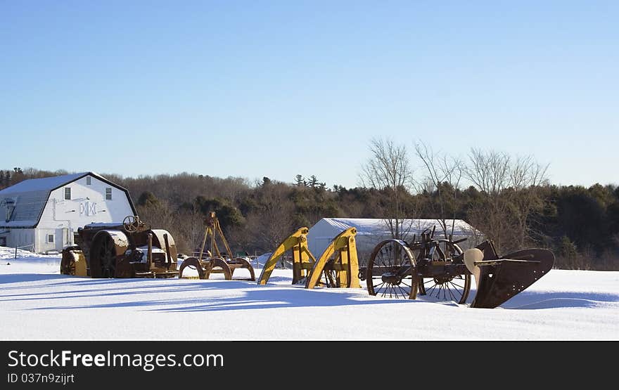 Winter farm eqipment with barn