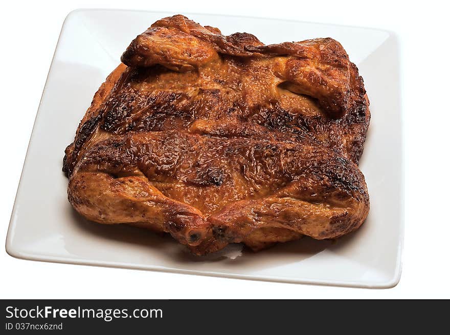 Roast Open Chicken served in a white plate