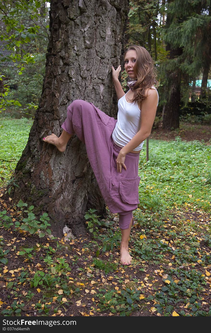 Girl in ethnic clothes outdoor in the park