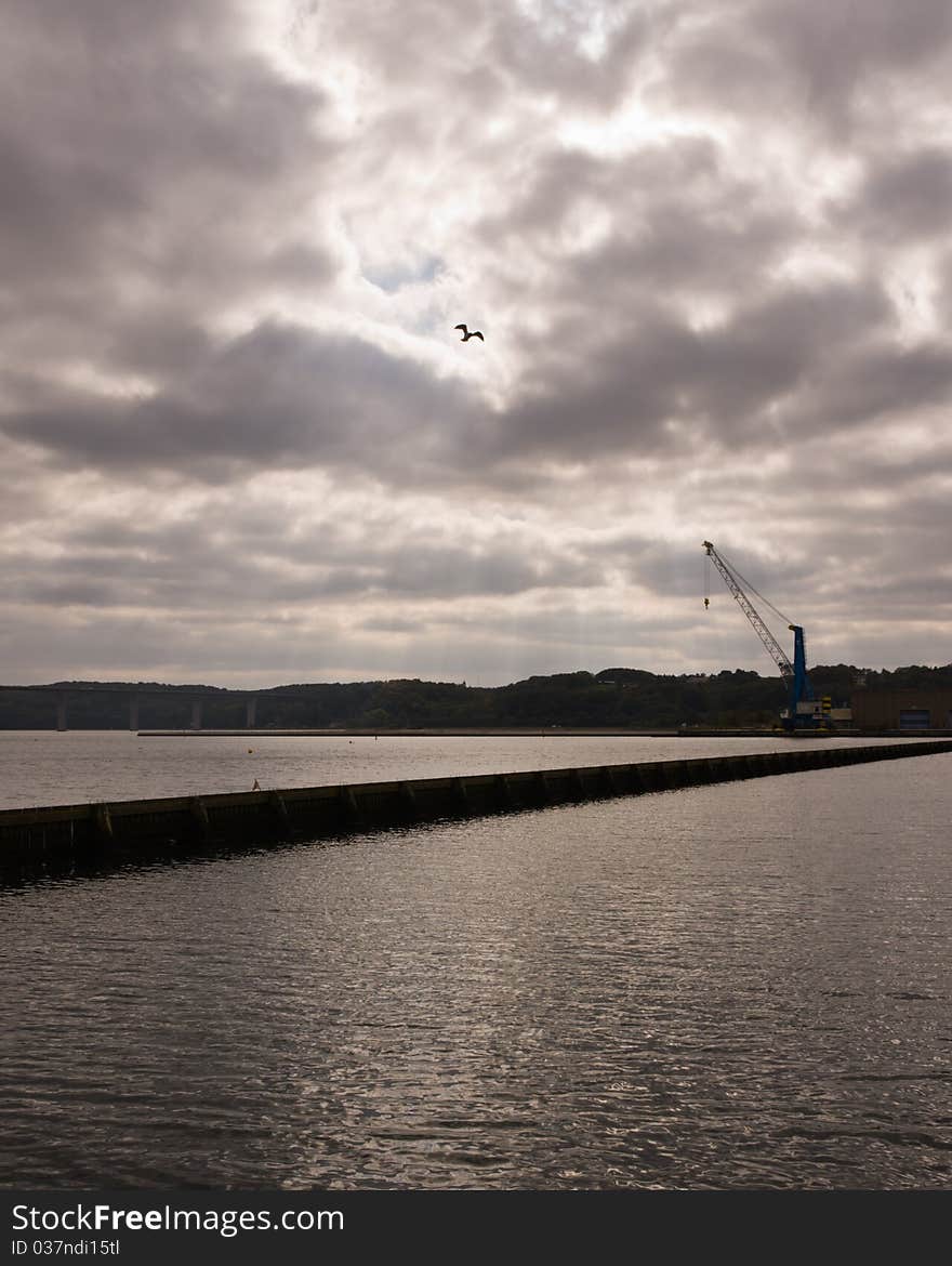 A moody scene of sunlight breaking through the clouds. A moody scene of sunlight breaking through the clouds.