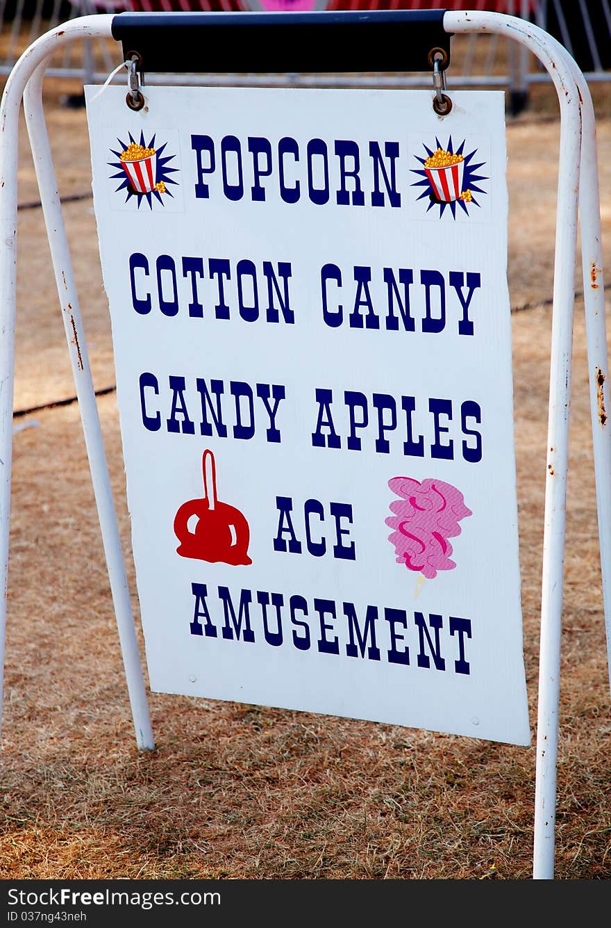 Photo of a Popcorn and other sweets sign at a carnival. Photo of a Popcorn and other sweets sign at a carnival.