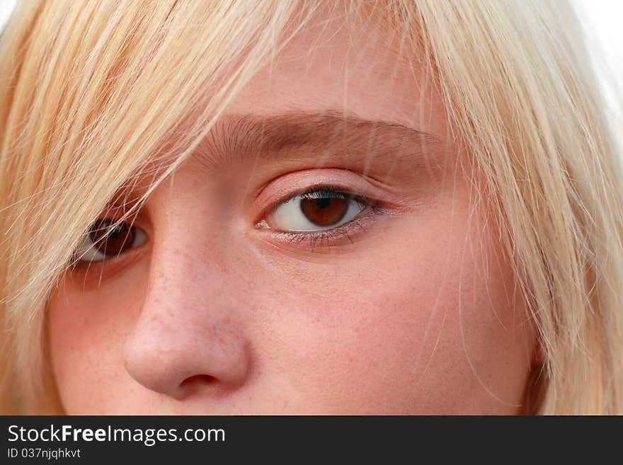 Close up of the blonde girl with brown eyes.