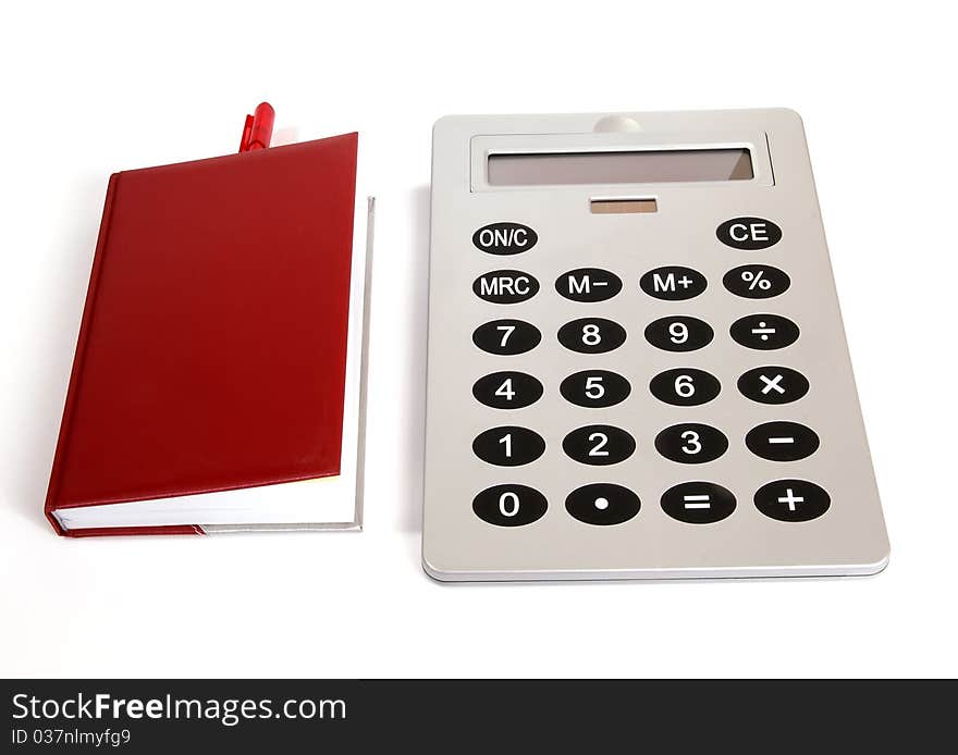 Great calculator and red notebook for reference daily notes with a pen on a white background