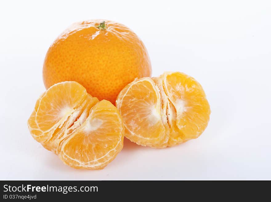 Ripe tangerines on white background.