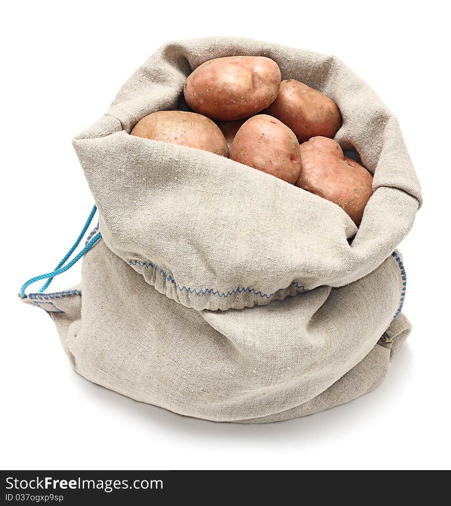 Sack of potatoes raw vegetables isolated on white background.