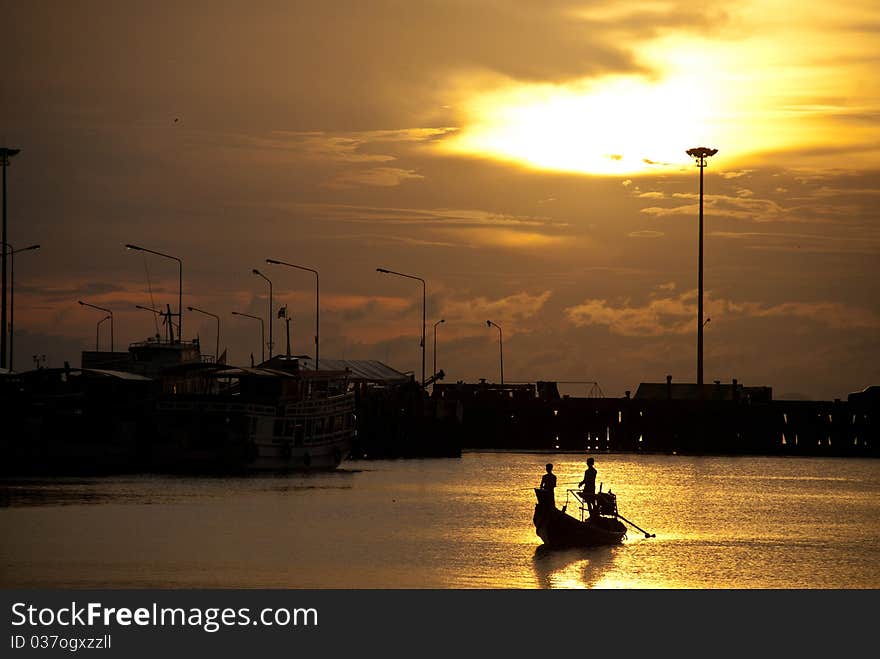 Fisherman silhouette at samui pier