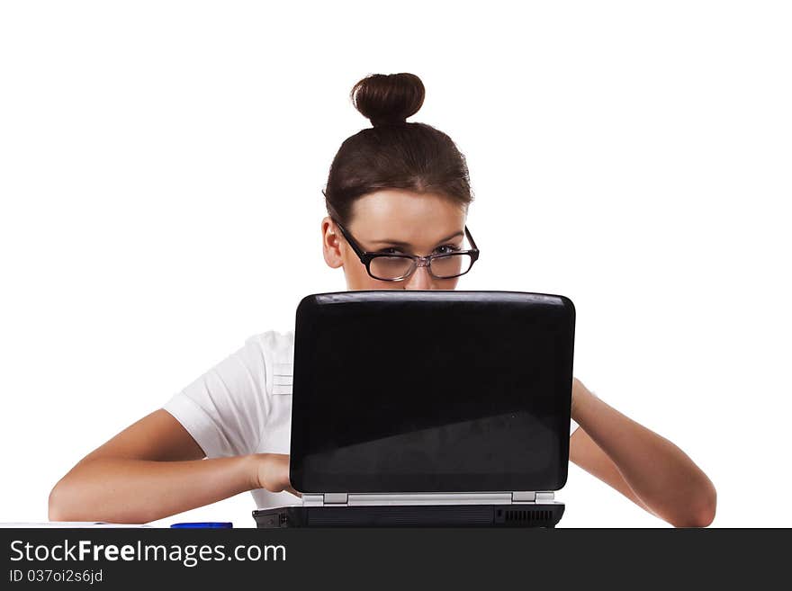 Woman with glasses sits at a table looks out from for the laptop and working on laptop A series of office work. Woman with glasses sits at a table looks out from for the laptop and working on laptop A series of office work
