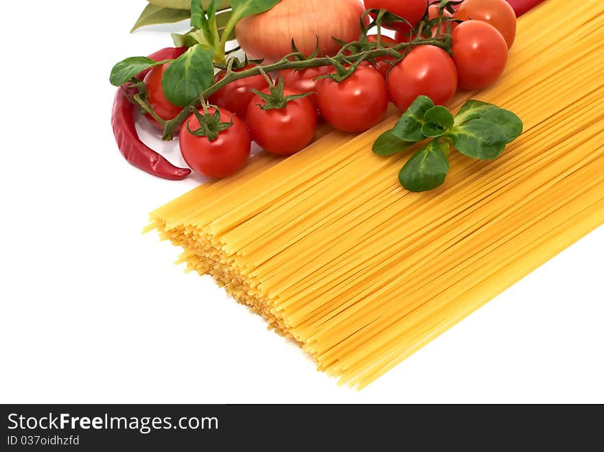 Italian pasta spagetti with vegetables on a white