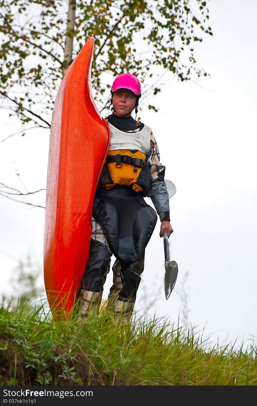 Girl with puddle and kayak