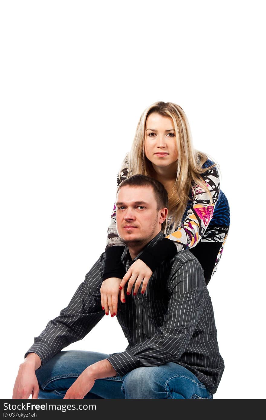 Portrait of a beautiful young happy couple isolated on white