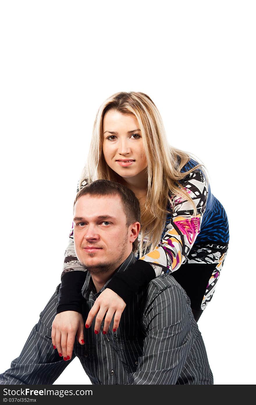 Portrait of a beautiful young happy couple isolated on white