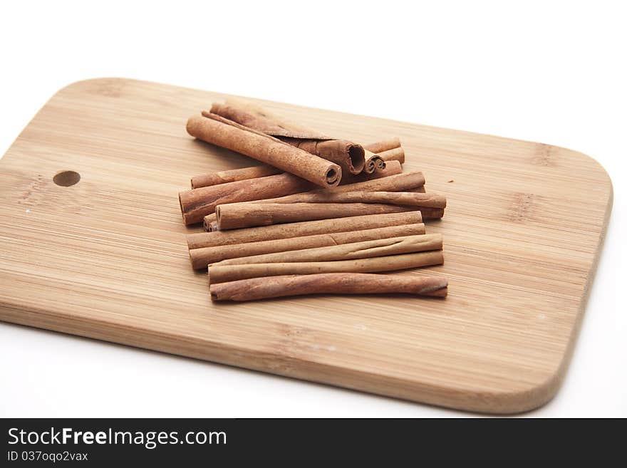 Cinnamon poles on edge board with hole