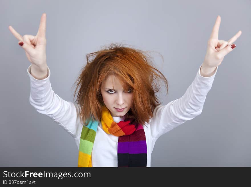 Red-haired rock girl in scarf. Studio shot.