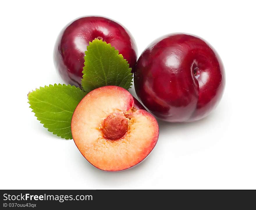 Plums isolated on white