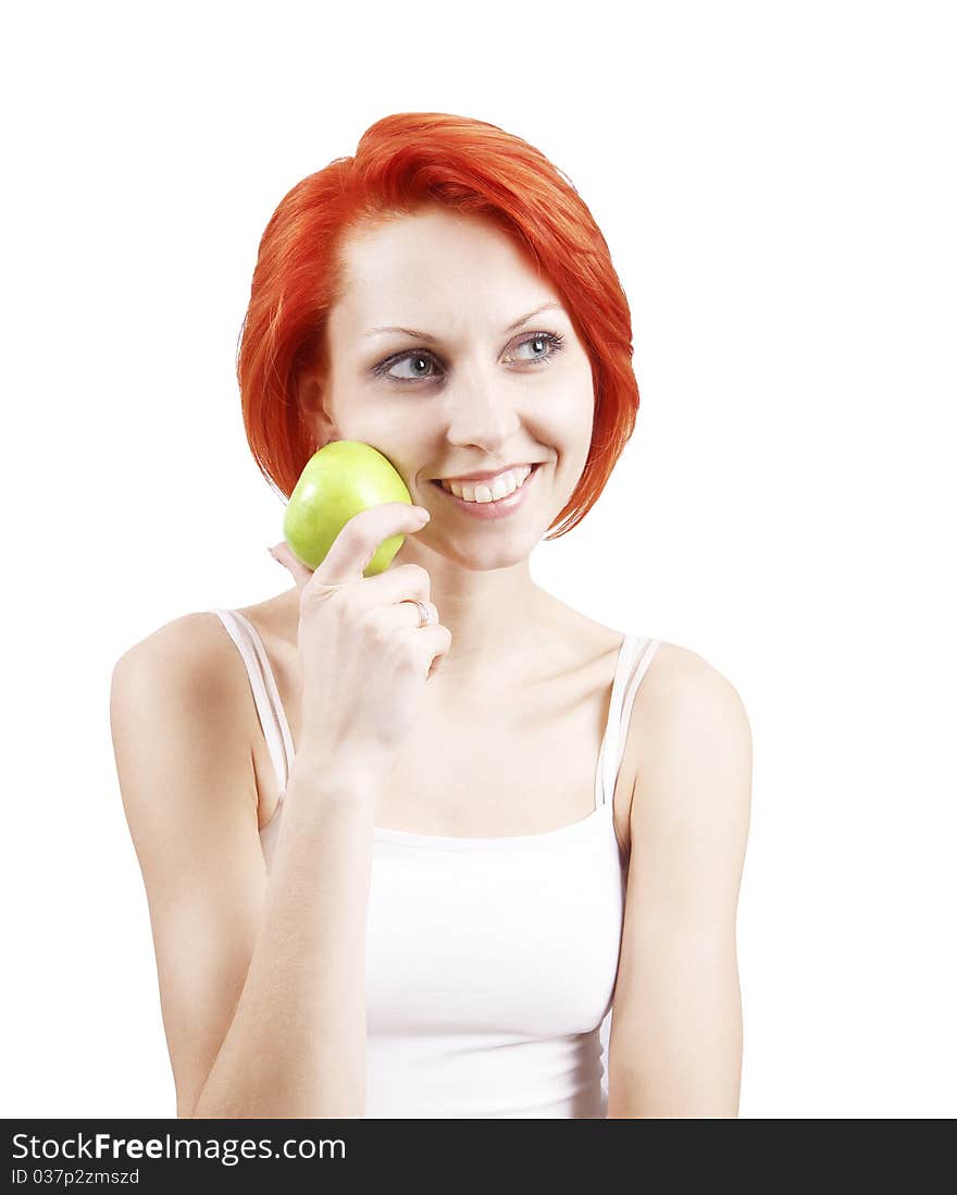 The girl holding an apple in a hand on the isolated white background. The girl holding an apple in a hand on the isolated white background