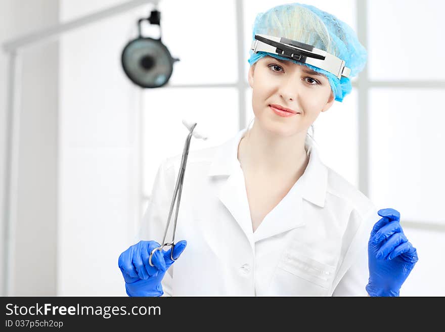 Young working beautiful woman doctor in uniform