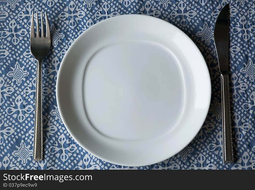 Set of dishware on blue texture. Set of dishware on blue texture.