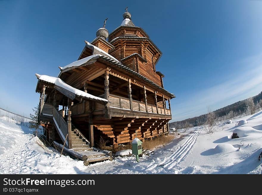 Snow-covered wooden church in winter day. Snow-covered wooden church in winter day