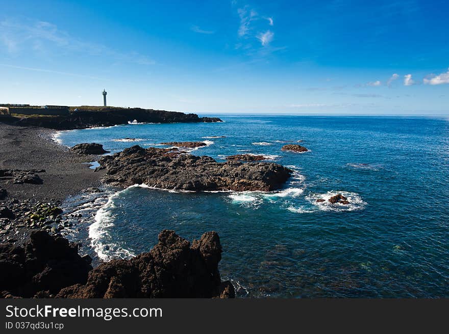 The lighthouse at the Coast of La Bombilla, La Palma, Canary islands, Spain. The lighthouse at the Coast of La Bombilla, La Palma, Canary islands, Spain