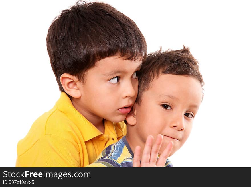 Children huddled looking at different directions with a hand in sign of stop