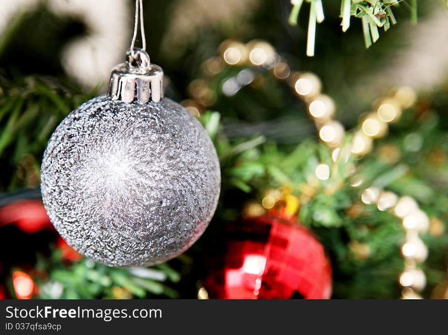 Christmas ball hanging from a tree decorated