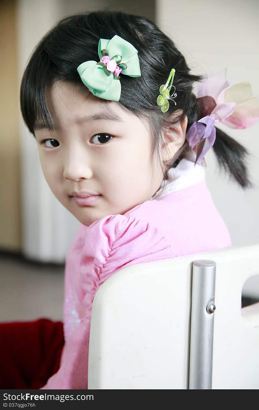 Cute Chinese little girl turning back. Cute Chinese little girl turning back.