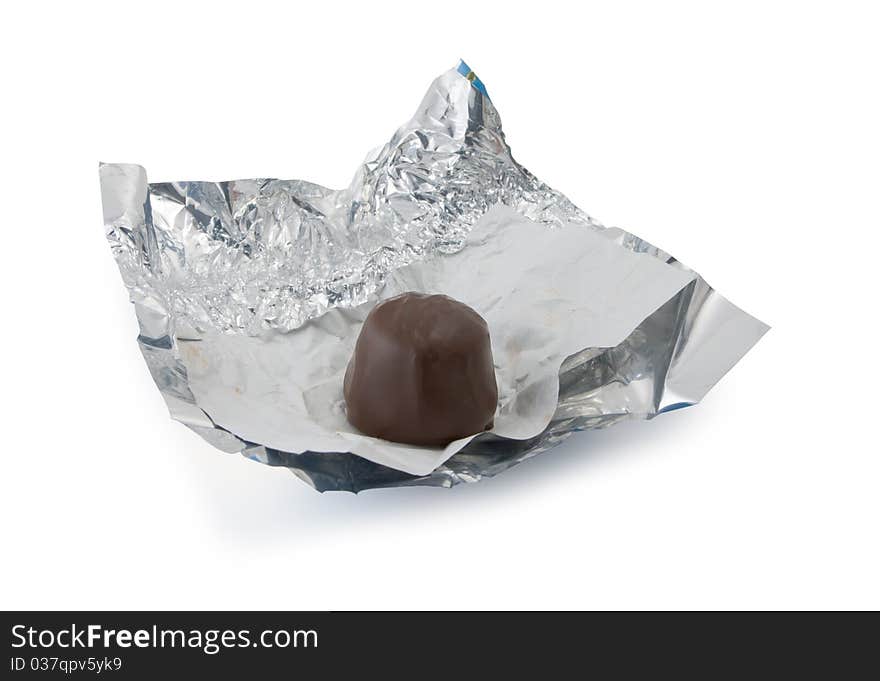 Chocolate on a foil isolated on a white background