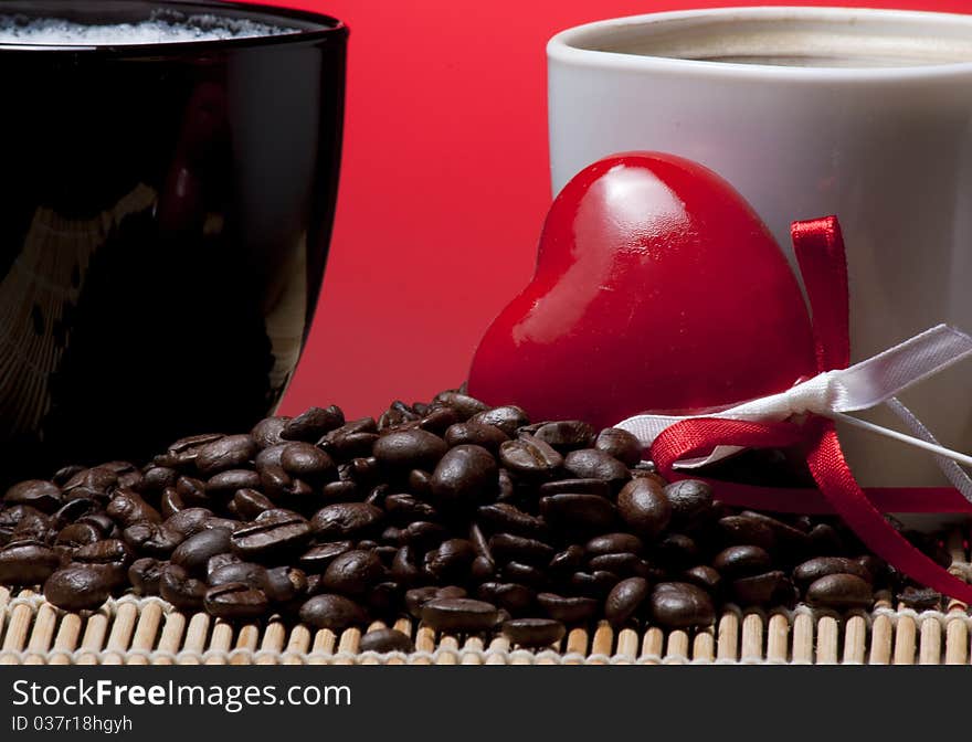 Coffee cups, heart and beans