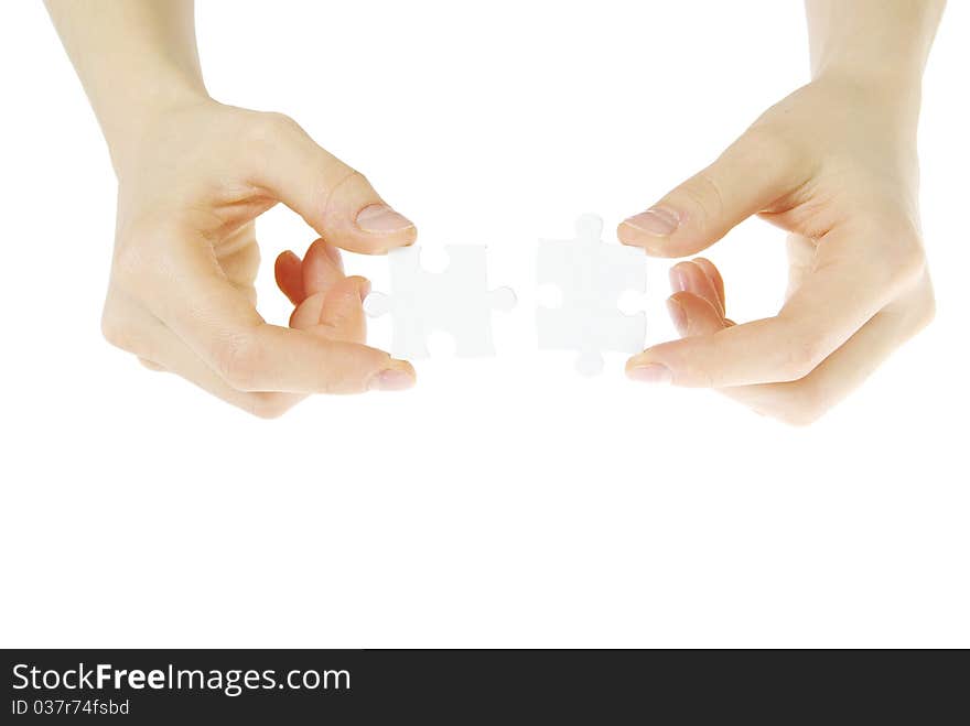 Puzzle in hands isolated on white background