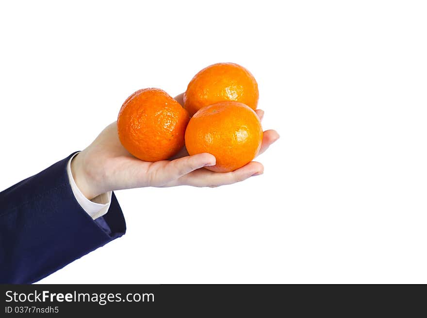 Female hand with oranges background