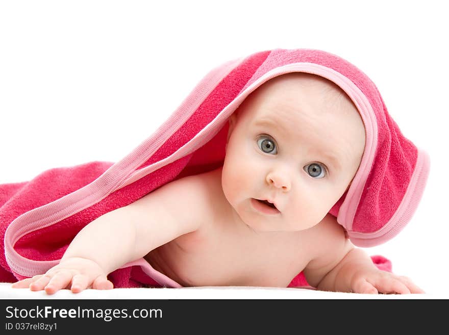 Surprised kid looks at a white background.