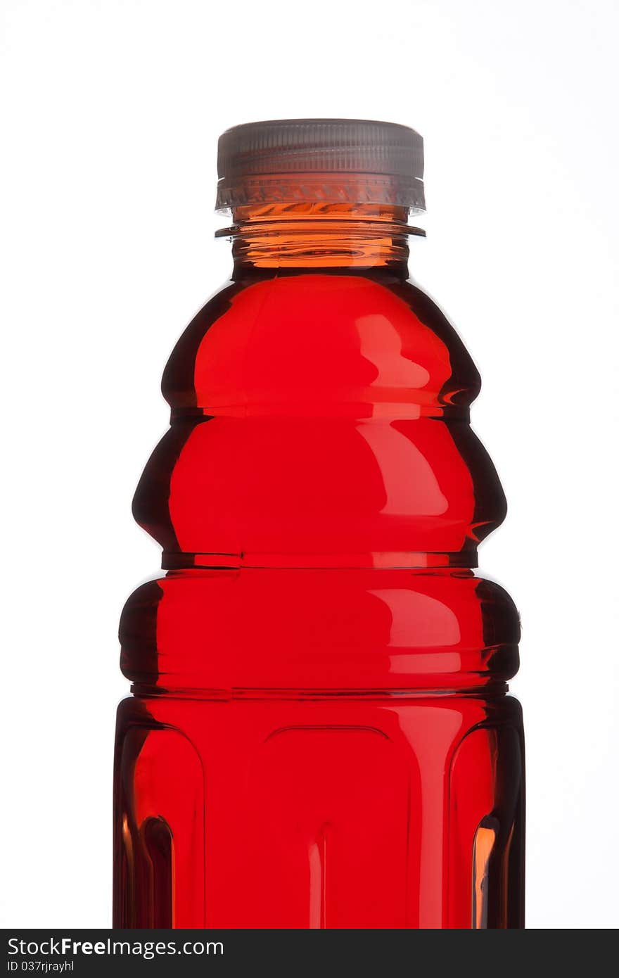 Plastic bottle with blackcurrant juice on white background