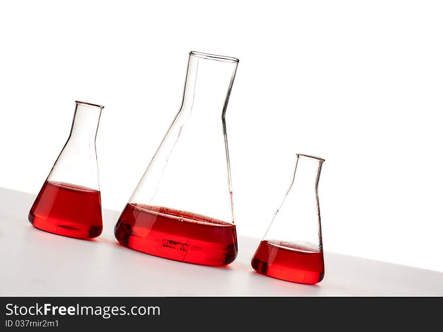 Three flasks with red liquid. Three flasks with red liquid.