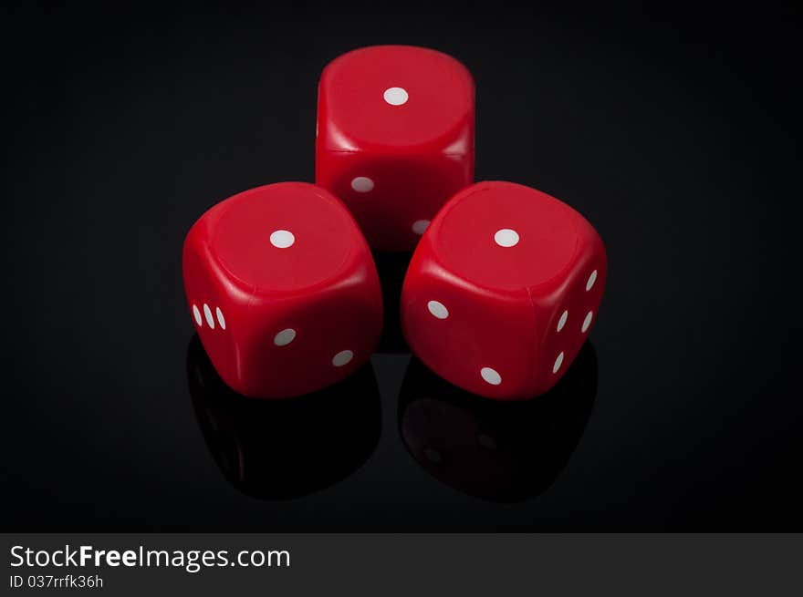 Closeup of three red dice on green background. Closeup of three red dice on green background