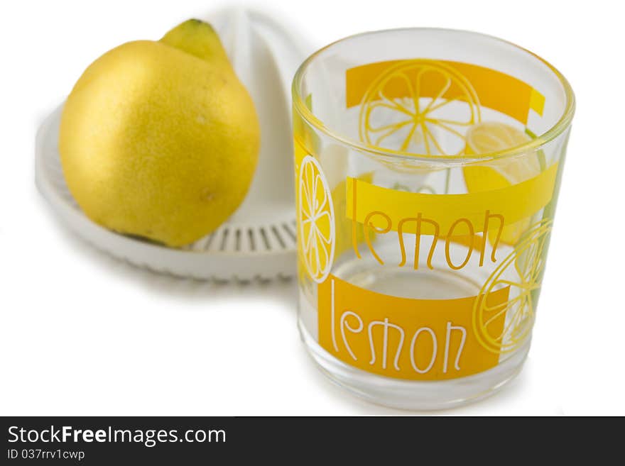 Lemon and juicer isolated