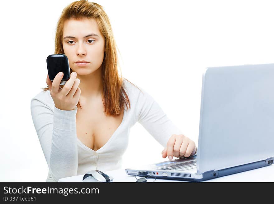 Young adult red haired business lady over white frustrated with her computer. Young adult red haired business lady over white frustrated with her computer