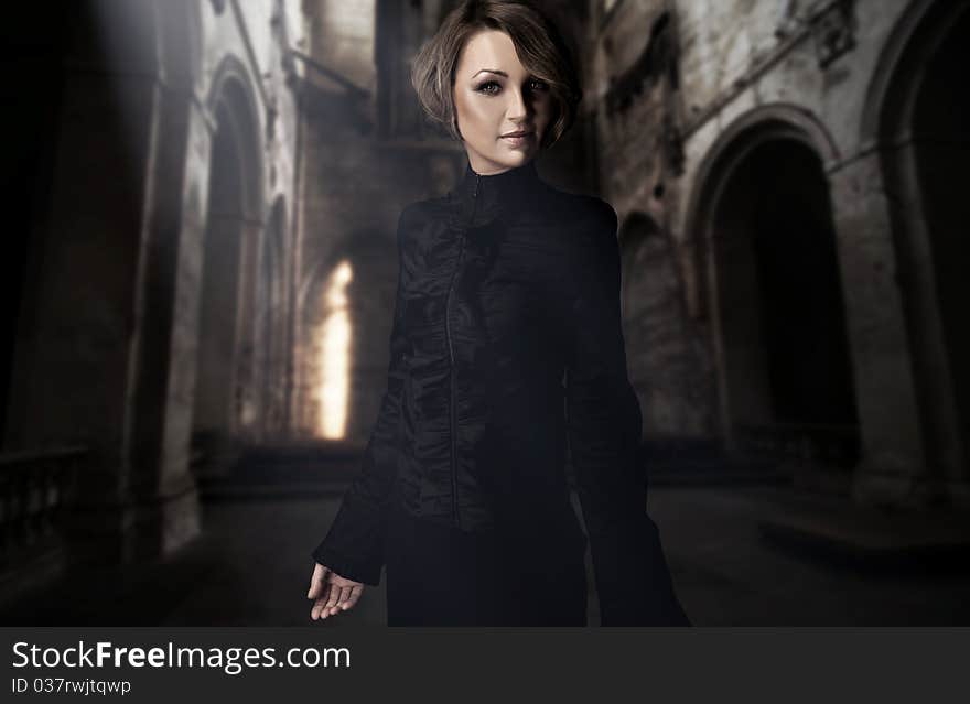 Young Woman Posing In A Castle Interior