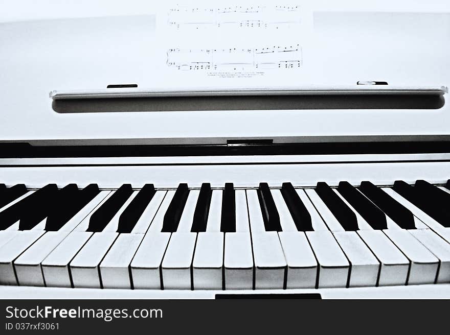 A closeup of a piano key. A closeup of a piano key.