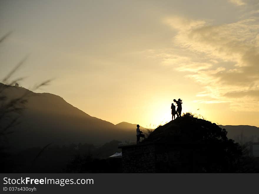 Silhouette of people in sunset light